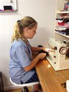 Amber sewing her bag straps